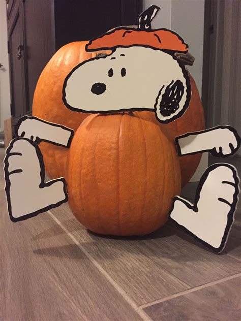 The kids go trick-or-treating, passing by the pumpkin patch to mock Linus. . Snoopy carved pumpkin